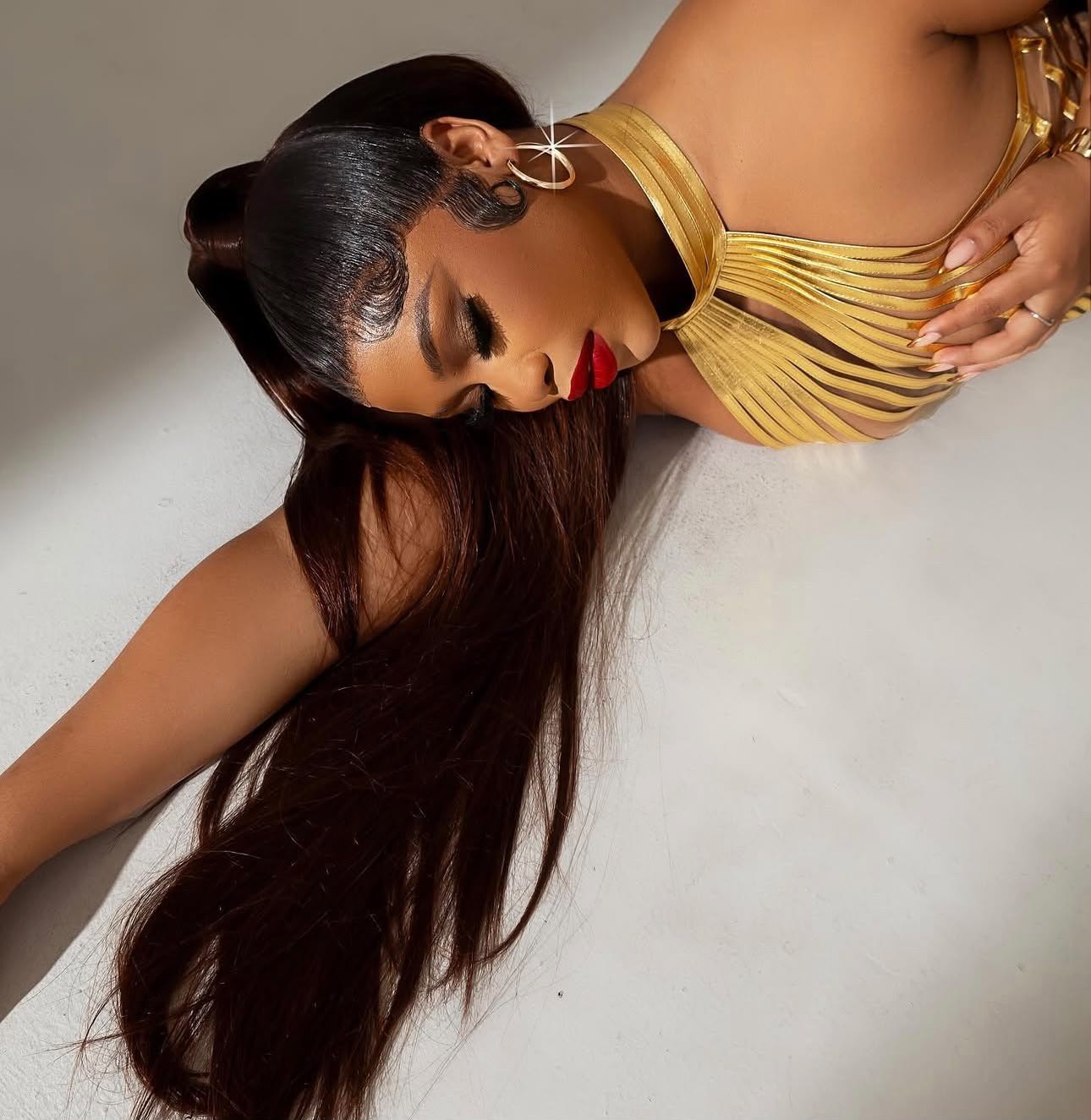 Magnolia Hair & Beauty client with a sleek long human hair install and gold styling