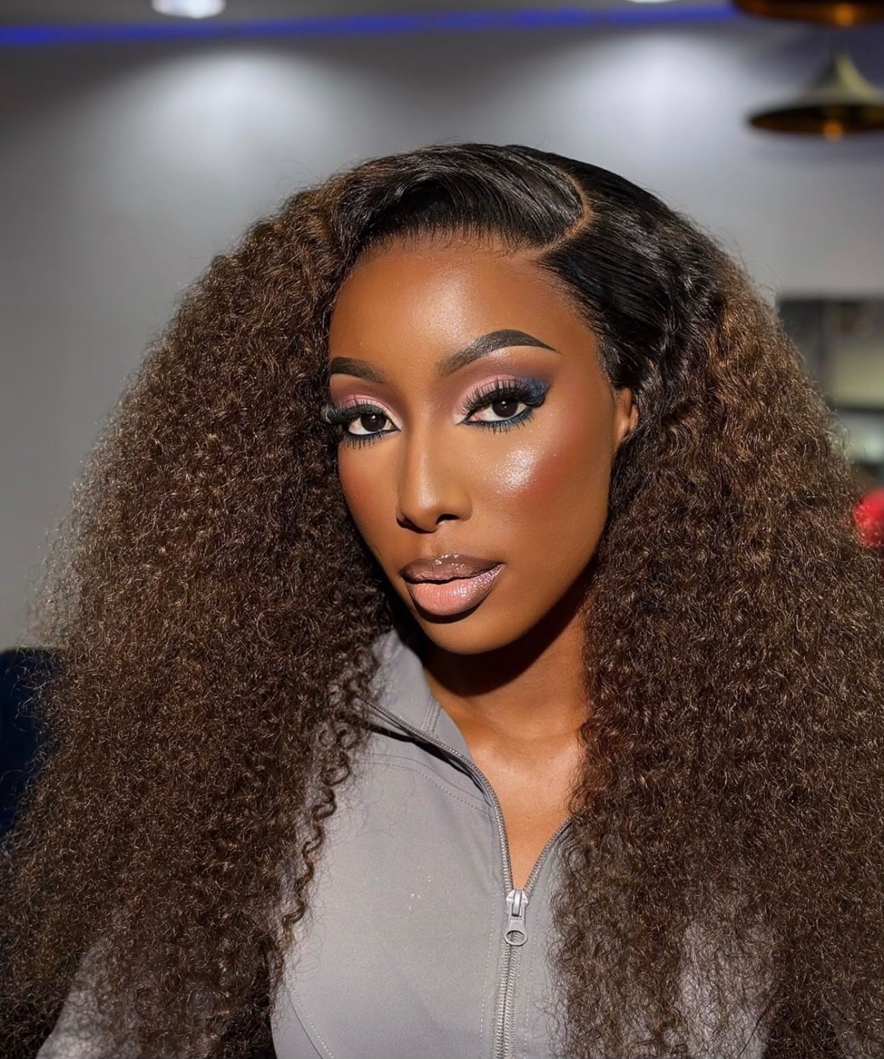 100% human virgin hair wig on display at Magnolia Hair & Beauty